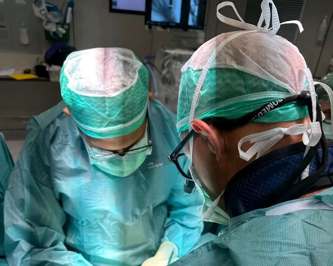 Hand surgical team working under loupe magnification during a procedure